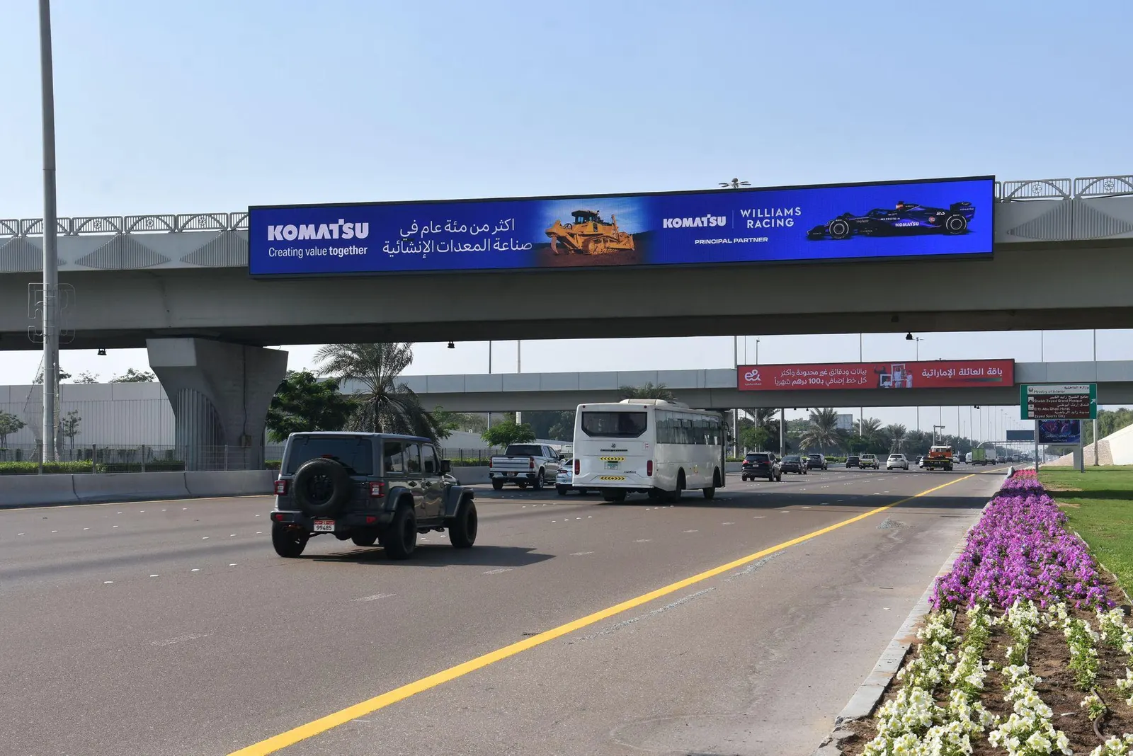 Komatsu bridge banner on the route to Yas Marina Circuit